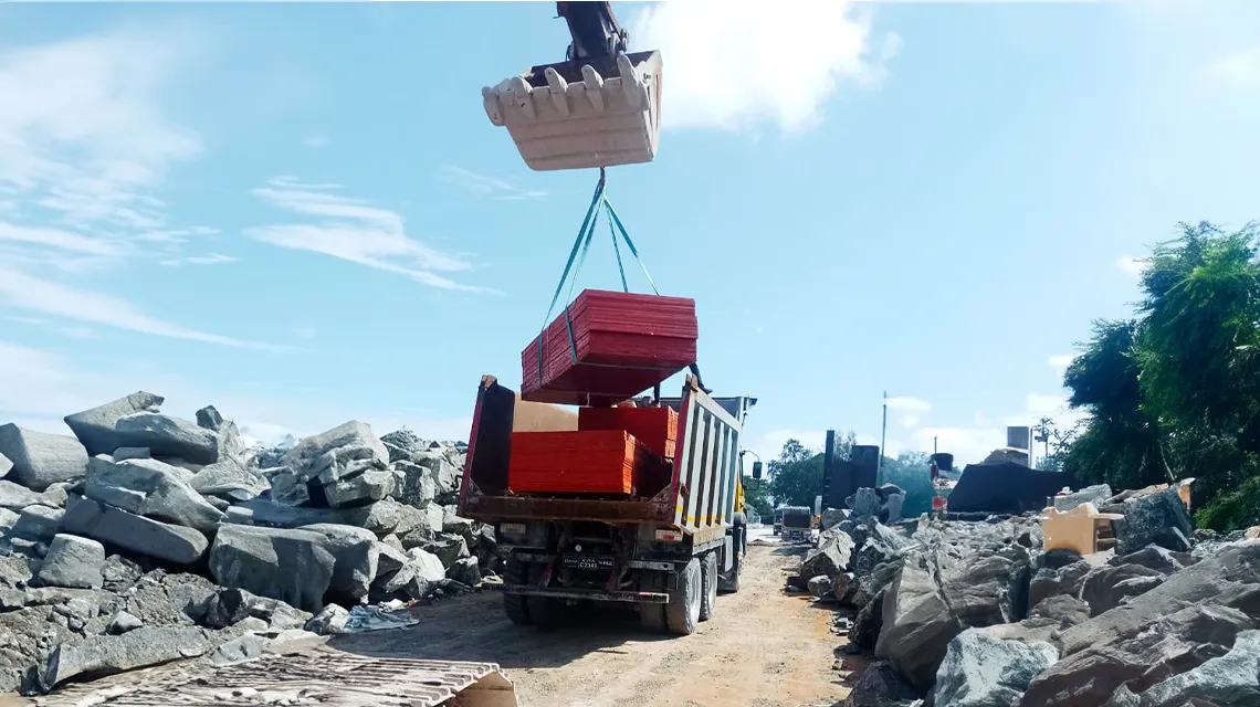 Plywood pallets unloading from barge to island